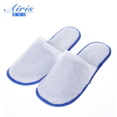 China Quick Dry Compressed Disposable 3mm Hotel Nonwoven Slipper Whitening Pressed EVA Sole Slippers for sale