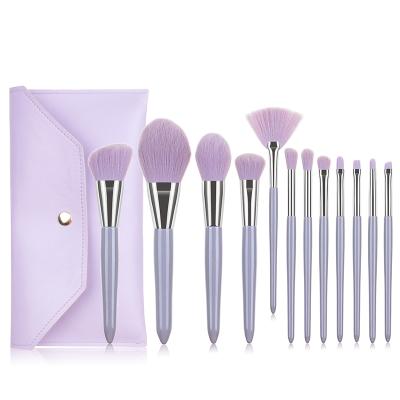 China Angular Blush 2021 New Design Creative Baby Tool Purple Makeup Brush Set With Bag for sale