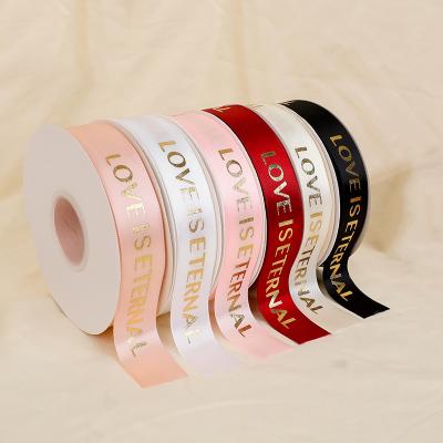 China Sustainable Factory Customized Logo Gold Foil Printing Bouquet High End Gift Wrapping Polyester Ribbon for sale