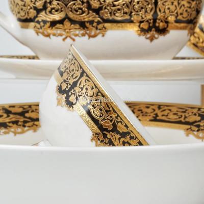 China RTS viable posuda 50pcs embossed gold dinner fancy new bone china ceramic tableware set for sale