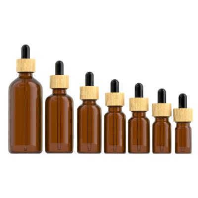 China Cosmetic Eco-friendly Amber Glass Bamboo Black Glass Bottle Essential Oil Dropper Bottles 10ml 15ml 20ml 30ml 50ml 100ml for sale