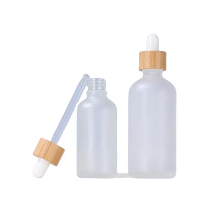 China Cosmetic CBD oil 5ml 10ml 15ml 20ml 30ml 1oz 50ml 100ml frosted glass dropper bottles with bamboo pipette dropper for sale