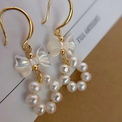 China Fashionable Natural High Quality Freshwater Pearl Women's Bow Pearl Earrings 4-5mm Bow Pearl Earrings for sale