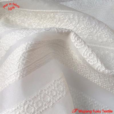 China New anti-static polyester jacquard organza lace fabric for elegant dress for sale