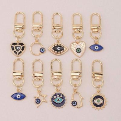 China Fashion Creative Sun Heart Five Star Demon Eyes Stainless Steel Pendant Key chain Custom Order 14k Gold Sex Demon Eyes Fashion Key chain for sale