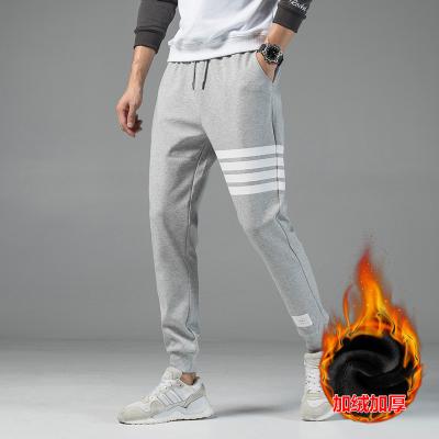 China Autumn Breathable Winter Thick Warm Sweatpants For Men's Casual Joggers Trousers White Striped Drawstring Pockets Pants Men for sale