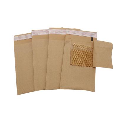 China Biodegradable Honeycomb Kraft Paper Mailers Bags Shipping Packing Padded Shockproof Bags for sale