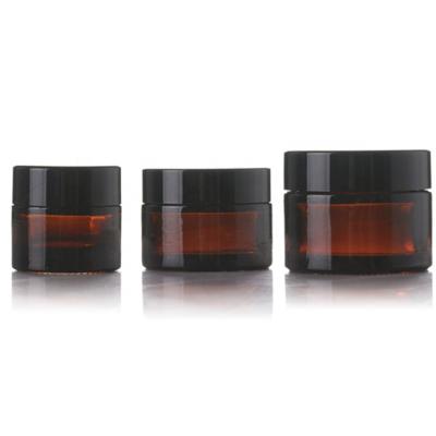 China Skin Care Cream Amber Cream Glass Jar 2oz With Black Aluminum Cap Frosted Eye Cream Glass Cosmetic Jar for sale