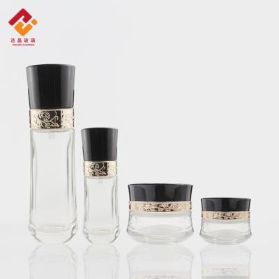 China e-friendly luxury glass cosmetic bottle and cosmetic jars lotion bottle with pump skin care packaging set for sale