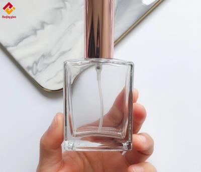 China Customized Perfume Clear Square Spray Glass And Rose Gold Cap for sale