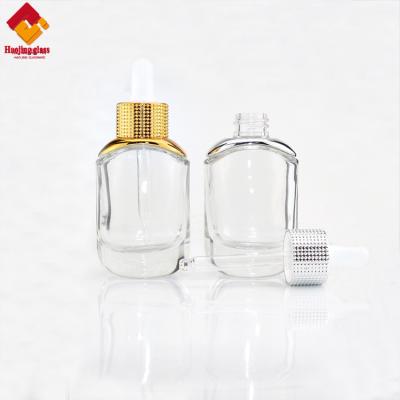 China Wholesale Silver Cap Gold Perfume Essential Oil Glass Clear Dropper Bottle for sale