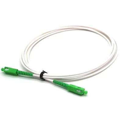 China Telecommunication 1.5m Color G657A1 Single Mode SC APC White Simplex Fiber Optic Patch Cord for sale