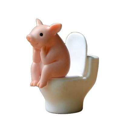 China Europe Cute Pig Sitting on the Toilet Pig PVC Animal Model Action Figure Decoration Mini Kawaii Toy for Home Decor Children Kids Gift for sale