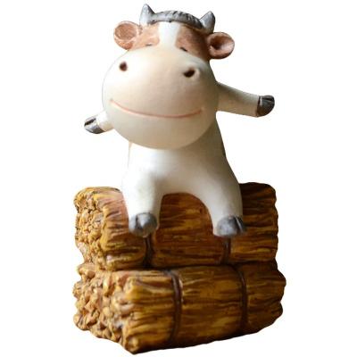 China Z15710A Europe Hot Resins Cute Zodiac Calf Sitting on Haystack Products Ornaments Mini Bonsai Table Decoration Desktop Ornaments for sale