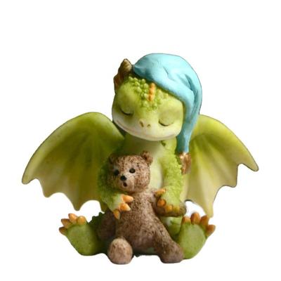 China Z13748A Europe resin dragon figure with hat cute statue handcraft dragon figurine with teddy bear toy for sale