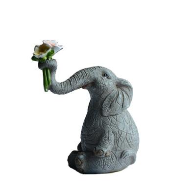 China Z13251A Europe Decor Cute Mini Resin Craft Office Gift Animal Elephant With Flower Figurine for sale