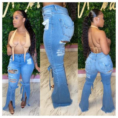 China Newcomers M1002 Breathable Fashion Skinny Light Blue Denim Flare Pants Ripped Distressed Denim Women for sale