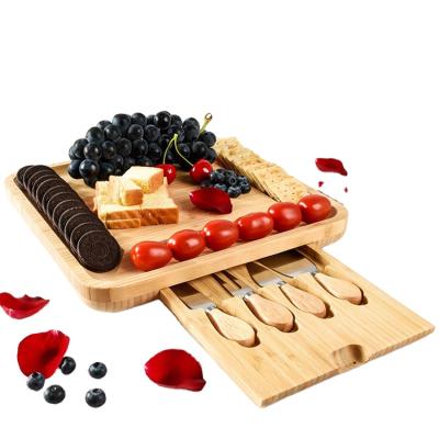 China Perfect Kitchen Resturant Bakery Housewarming Charcuterie Tray Cheese Tools Bamboo Cheese Board Set with Hidden Magnetic Drawer for sale