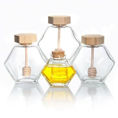 China Hot Sale 100ml 220ml 380ml 500g Hexagonal Clear Glass Honey Jam Jars With Wooden Bamboo Lid And wooden dipper for sale