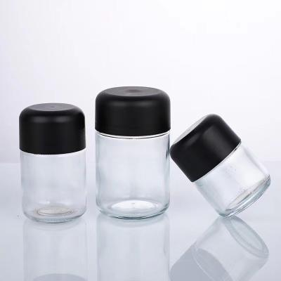 China 2 oz 3 oz 4 oz 6 ozairtight clear child resistant glass jar flower jar packaging containers with CR Cap for sale