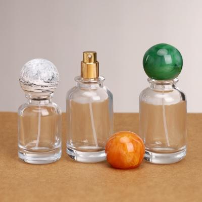 China Empty Round Transparent 30ml 50ml 100mlLluxury Glass Spray Perfume Bottle Crimp pump spray perfume glass bottle  for sale