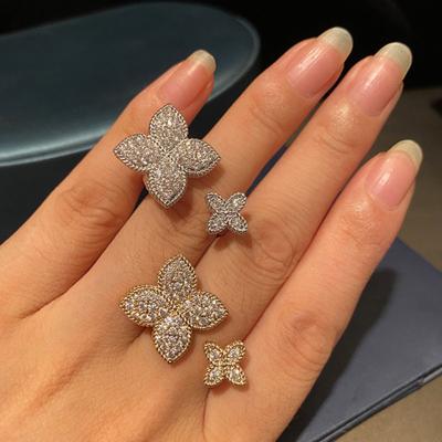 China FASHIONABLE New Design Brass Gold Plated Four Leaf Flower Pave Inlay Shiny Zircon Charm Rings For Women Party Jewelry for sale