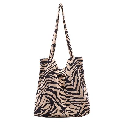 China Fashion high volume zebra printed cross shoulder bag fashion fluffy shoulder strap wide - body bag for women for sale