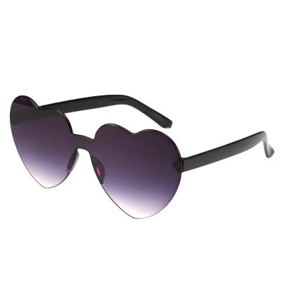 China Heart Shaped Rimless Sunglasses New Design Sunglasses Fashion Candy Color Heart Sunglasses Women Trendy Sunglasses for sale