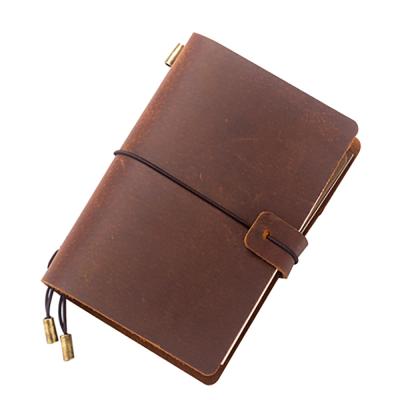 China Classic Genuine Leather Handmade Diary Travel Journals Custom A6 Hardcover Notebook Diaries with Elastic Closure en venta