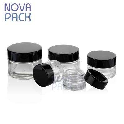 China Skin Care Cosmetic Packaging 5ml 10ml 15ml 20ml 25ml 30ml 50ml 100ml Clear Colored Glass Cosmetic Jars With Black Lid for sale