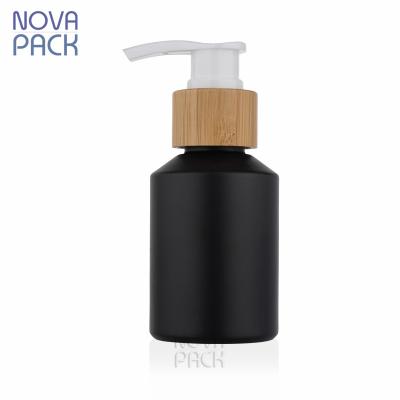 China Black Cosmetic Bamboo Matte Shoulder Slope Bottle 60ml 100ml 120ml Packaging 2oz Skin Care Glass Bottle With Bamboo Lotion Pump for sale