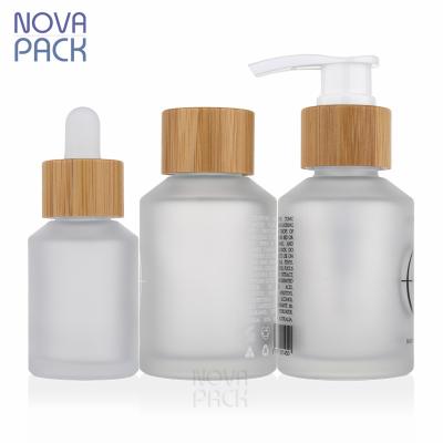 China Bamboo Cosmetic Bottle Packaging 60ml 100ml 120ml 200ml Frosted Body Facial Lotion Skin Care Detergent Pump Glass Bamboo Bottle for sale