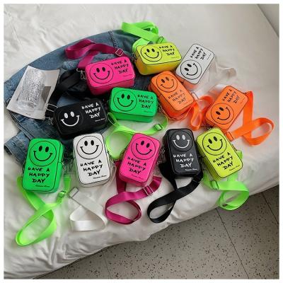 China Newspaper Used New Fluorescent Color Smiley Face Mini Messenger Bags For Women Summer Girls Cute String Kids Coin Purses Handbags for sale