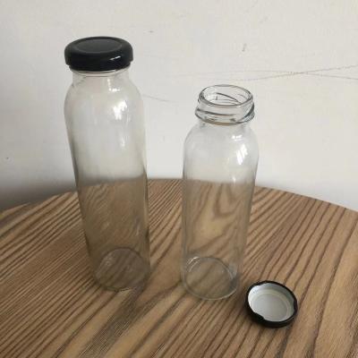 China Empty Glass Wine Bottle Factory 250ml 330ml Clear Milk Bottle With Screw Cap for sale