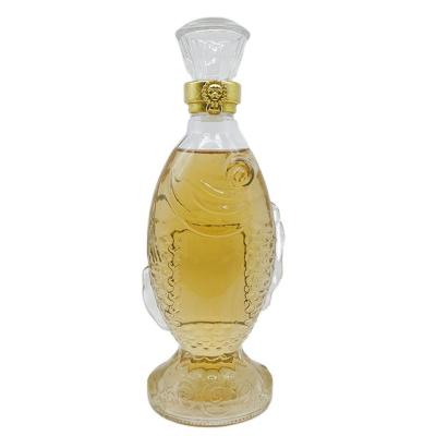 China Hot Sale Wine Glass Bottle Wholesale 500ml Fish Shape Glass Liquor Bottle for sale