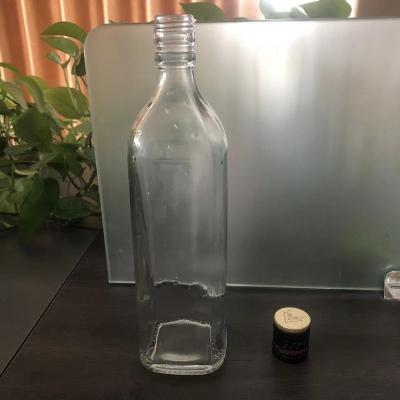 China Wine Glass Bottle Supplier High Clear Square 700ml Empty Shape White Material Liquor Bottle for sale