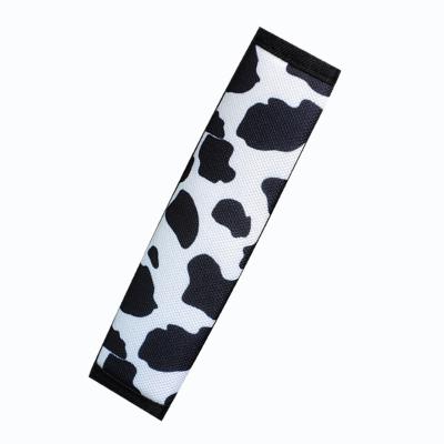 China New Long Durability Cows Pattern Cloth Car Cushion Protector Black White Seat Belt Cover for sale