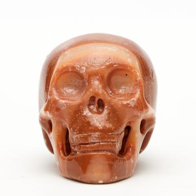 China Wholesale China Sunset Bulk Natural Glow Red Crystal Skulls For Decoration for sale