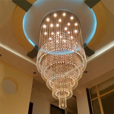 China Modern luxury hotel large glass crystal high ceiling k9 staircase led raindrop pendant lighting chandelier for sale