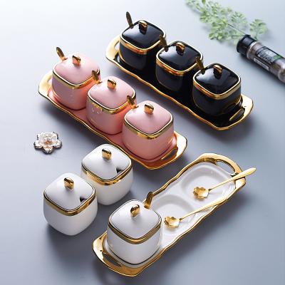 China Luxury Ceramic Wholesale Kitchen Spice Jar Canister Food Storage Seasoning Ceramic Jar with Spoon and Lid Tray Set for sale