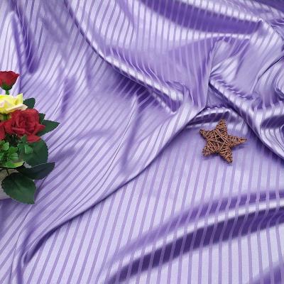 China Pure good quality cheap woven fabric jacquard polyester satin stripe nightgown sleepwear dress fabric for sale