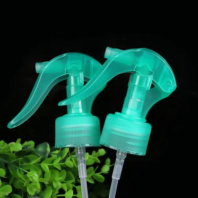 China Non Spill 28/410 Transparent Blue Plastic Mini Trigger Sprayer With Ribbed Closure for sale