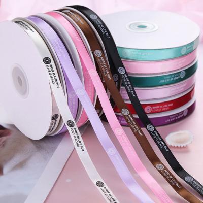 China Custom Colored Logo Roll Sublimation Printed Satin Tape Viable Wholesale Design Gift Package Colored Ribbon for sale