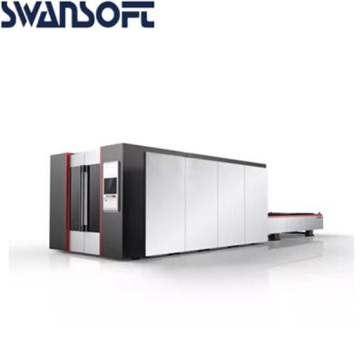 China Carbon steel aluminum 3000W fiber laser cutting machine with cover exchange table 3000x1500mm for sale