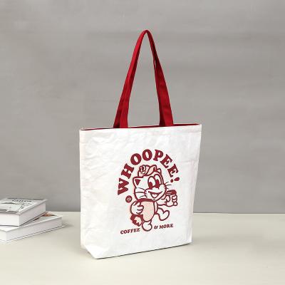 China Custom Pattern Dupont Recyclable High Quality Paper Bag Wash Kraft Paper Bag Hand Rubbing Shopping Bag for sale