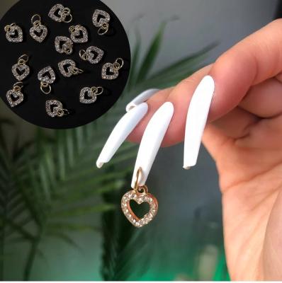 China 10PCS/Bag Fashionable 3D Nail Charm Gold Heart Dangle Alloy Glitter Nail Jewelry Diamond Nail Rhinestone Pendants for sale