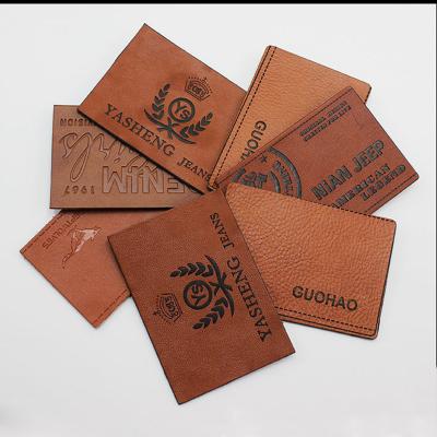 China Sustainable Metal Embossed Leather Logo Patch Debossed Text Jeans Branded With Metal for sale