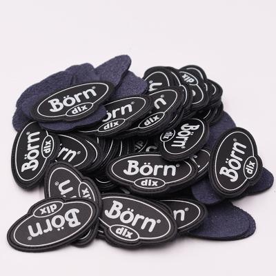 China Durable Custom Jeans PU Metal Embossed Leather Label Patch For Garment for sale