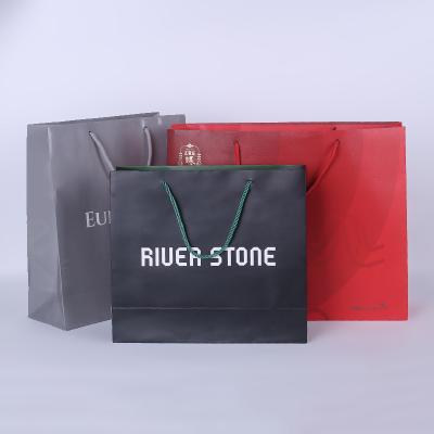 China Recyclable Custom Logo Luxury Shopping Bag Paper Bag With Ribbon Handle for sale