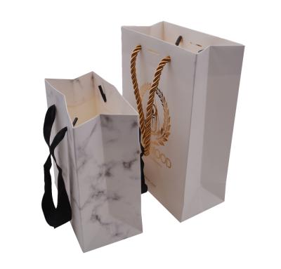 China Recyclable custom logo printed marble paper shopping bag with your own logo for packaging clothes makeup jewelry cosmetic paper bag for sale